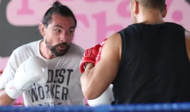 Jason Woodham, a Muay Thai trainer, coaching a student